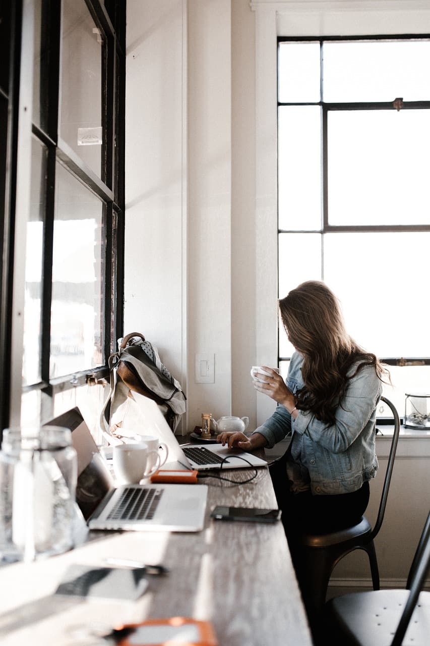 Person working on a laptop in an office environment
